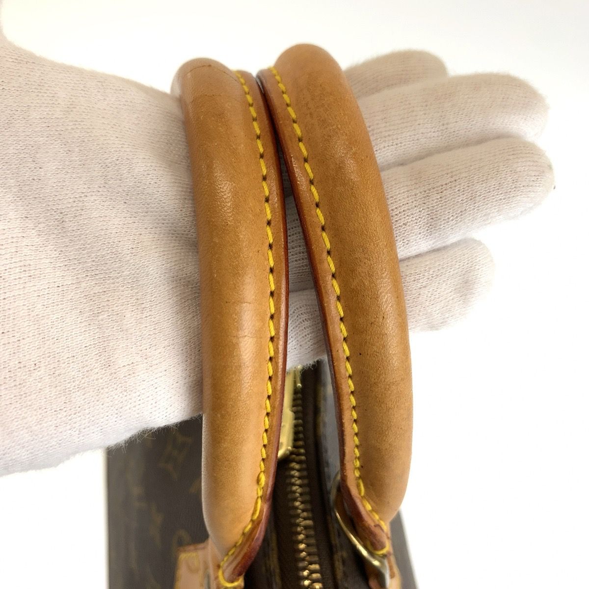 Louis Vuitton Alma Monogram Handbag